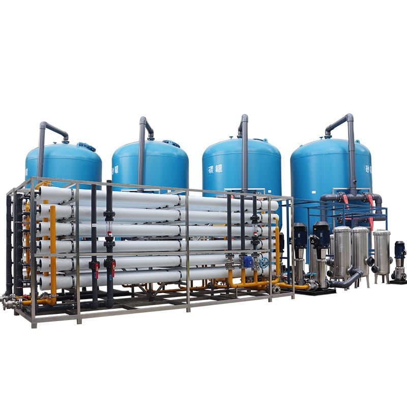 Industrial RO plant with membrane rack, blue pretreatment tanks, pumps and cartridge filters